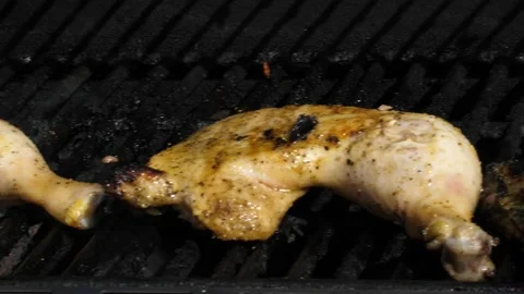 Portion of chicken grilling on a barbecue grid Stock Footage 150475814