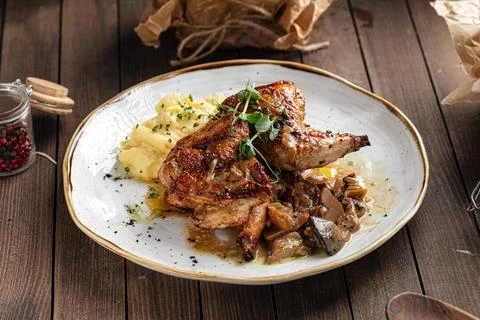 Portion of chicken with mashed potatoes Stock Photos
