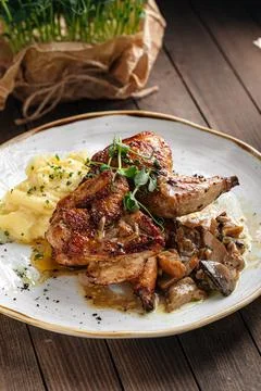 Portion of chicken with mashed potatoes Stock Photos