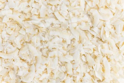 Portion of Coconut Chips as detailed close-up shot; selective focus Stock Photos