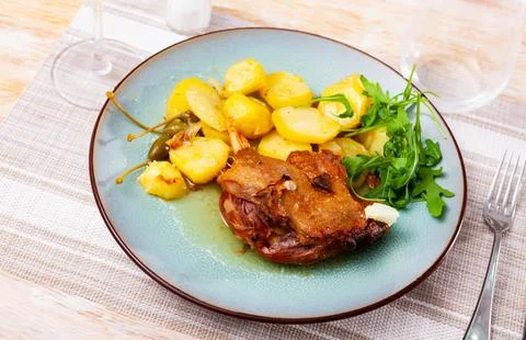 Portion of confit de canard served on plate Stock Photos