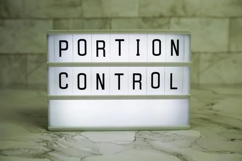 Portion ControlPortion Control letterboard text on LED Lightbox on marble b.. Stock Photos