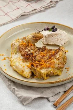 Portion of cooked chicken with nut cream Stock Photos