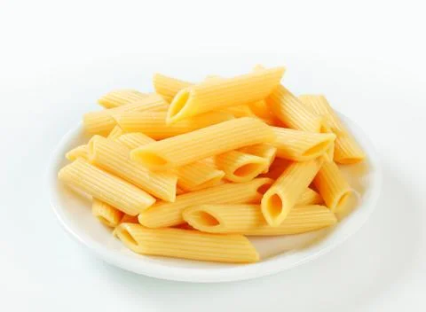 Portion of cooked penne pasta Stock Photos