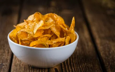 Portion of crispy Potato Chips (selective focus) Stock Photos