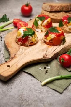 Portion of delicious chicken aspic on serving board on concrete table Stock Photos