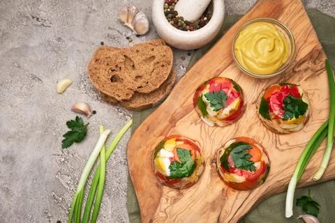 Portion of delicious chicken aspic on serving board on concrete table Stock Photos
