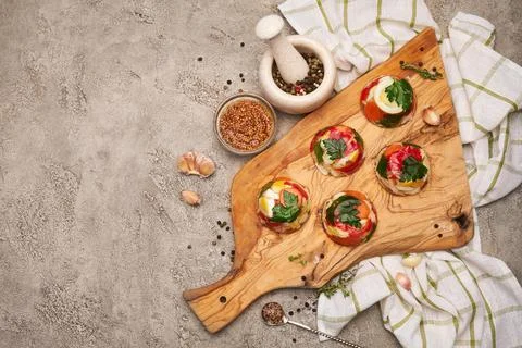 Portion of delicious chicken aspic on serving board on concrete table Stock Photos