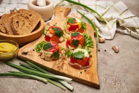 Portion of delicious chicken aspic on serving board on concrete table Stock Photos