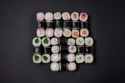 A portion of different rolls on the table, japanese food, sushi set on marble Stock Photos