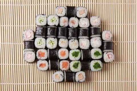 A portion of different rolls on the table, japanese food, sushi set on marble Stock Photos