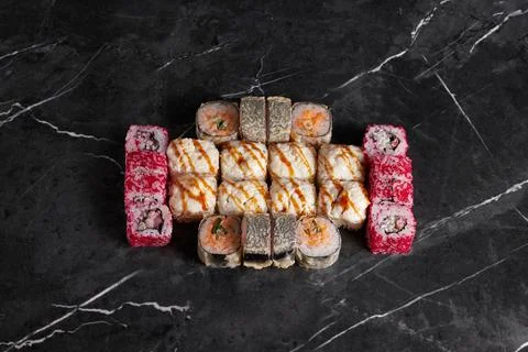 A portion of different rolls on the table, japanese food, sushi set on marble Stock Photos