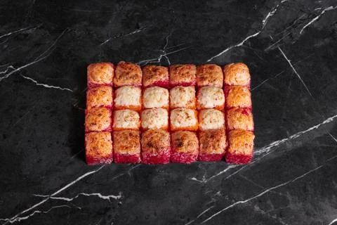 A portion of different rolls on the table, japanese food, sushi set on marble Stock Photos