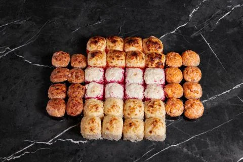 A portion of different rolls on the table, japanese food, sushi set on marble Stock Photos