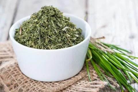 Portion of dried chive (in a bowl) Stock Photos