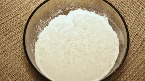 A portion of the flour in rotation, close-up Stock Footage 74228409