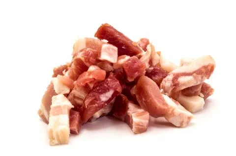 Portion of fresh diced Ham isolated Stock Photos