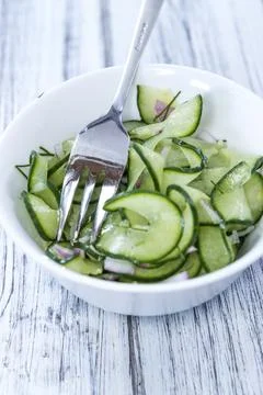 Portion of fresh made Cucumber Salad with onions and dill 写真素材