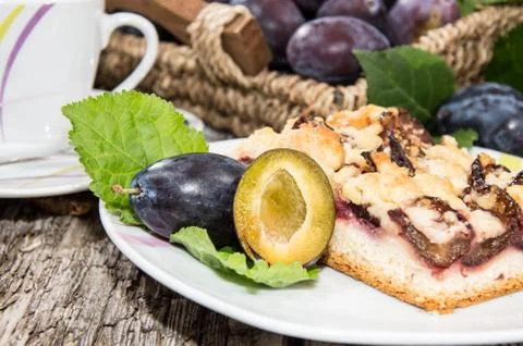 Portion of fresh plum cake Stock Photos