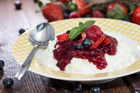 Portion of fruity rice pudding Stock Photos