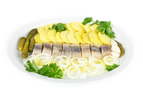 Portion of herring fish fillets with potato onion Stock Photos