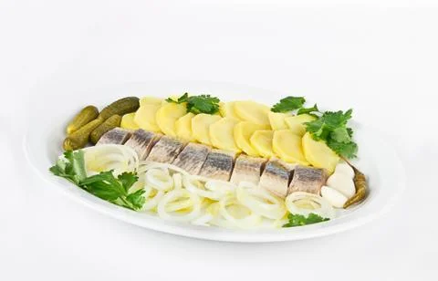 Portion of herring fish fillets with potato onion Stock Photos