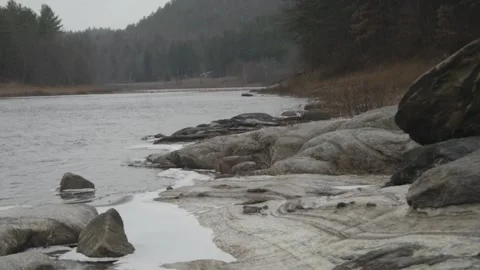 A portion of the Hudson flows quietly through Warren County Stock Footage 166004732