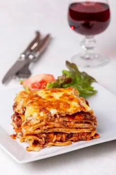 Portion of lasagna on a plate Stock Photos