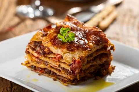Portion of lasagna on a plate Stock Photos