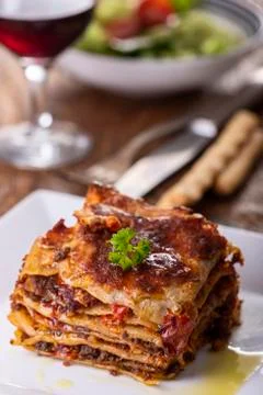 Portion of lasagna on a plate Stock Photos