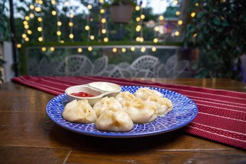 A portion of manta rays on a blue plate on the table Stock Photos