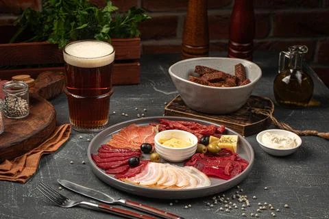 Portion of meat appetizer platter with beer Stock Photos