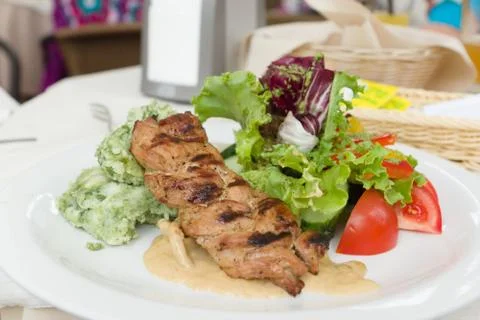 Portion of meat with salad Stock Photos