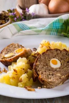 Portion of meatloaf on white plate with mashed potatoes Stock Photos