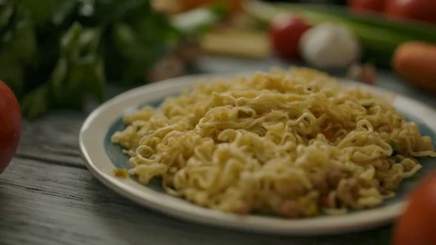 Portion of noodles amidst assorted vegetables Stock Footage 119976555