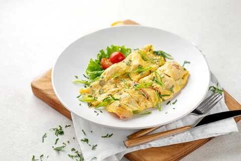 Portion of omelette breakfast with ham Stock Photos