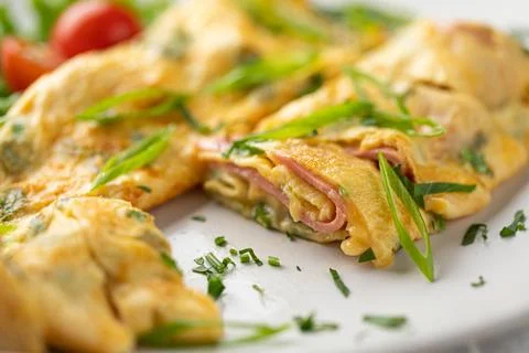 Portion of omelette breakfast with ham Stock Photos