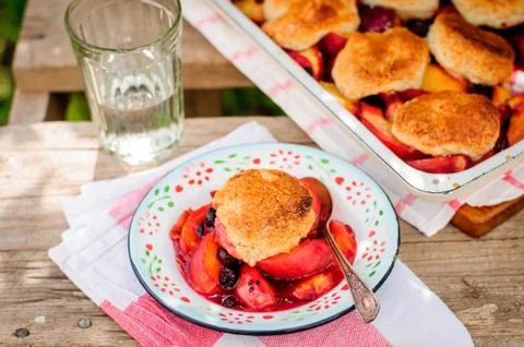 A Portion of Peach and Black Raspberry Cobbler Stock Photos