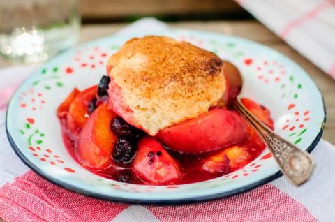 A Portion of Peach and Black Raspberry Cobbler Stock Photos