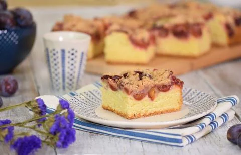 Portion of Plum Cake on a plate. Stock Photos