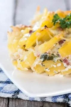 Portion of potato gratin Stock Photos