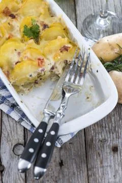 Portion of potato gratin Stock Photos