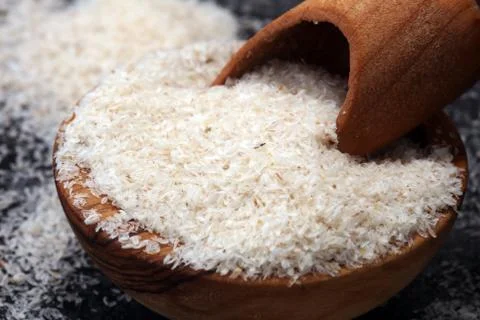 Portion of Psyllium Seeds on rustic dark background. Psyllium seed husks Stock Photos