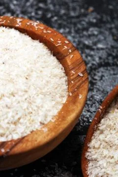 Portion of Psyllium Seeds on rustic dark background. Psyllium seed husks Stock Photos