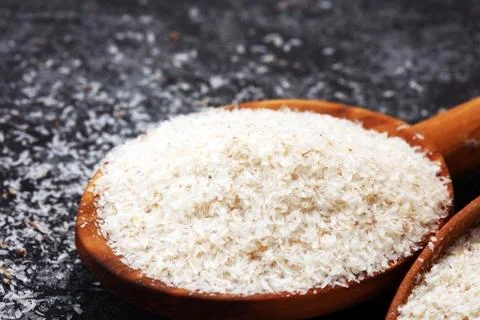 Portion of Psyllium Seeds on rustic dark background. Psyllium seed husks Stock Photos