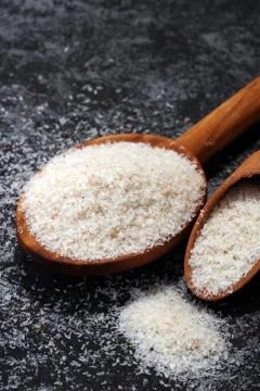 Portion of Psyllium Seeds on rustic dark background. Psyllium seed husks Foto stock