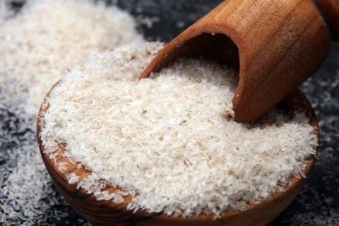 Portion of Psyllium Seeds on rustic dark background. Psyllium seed husks Foto stock