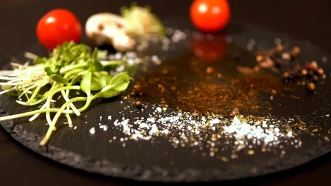 Portion of raw beef tossed onto a black board Stock Footage 105110413