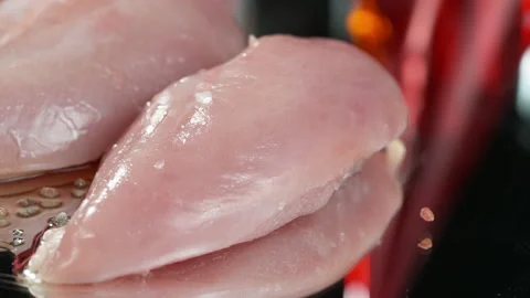 Portion of raw Chicken Fillet as seamless loopable 4K footage Stock Footage 131737474