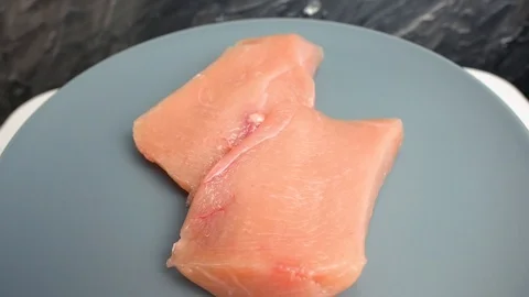 Portion of raw chickhen breast Stock-Footage 107734064